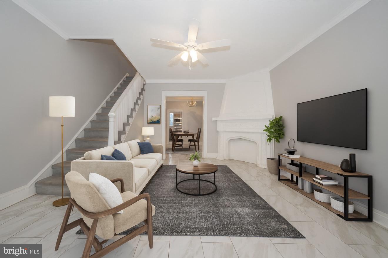 232 Copley Road Upper Darby, PA 19082 - Photo 2 of 47 a living room with furniture and a flat screen tv