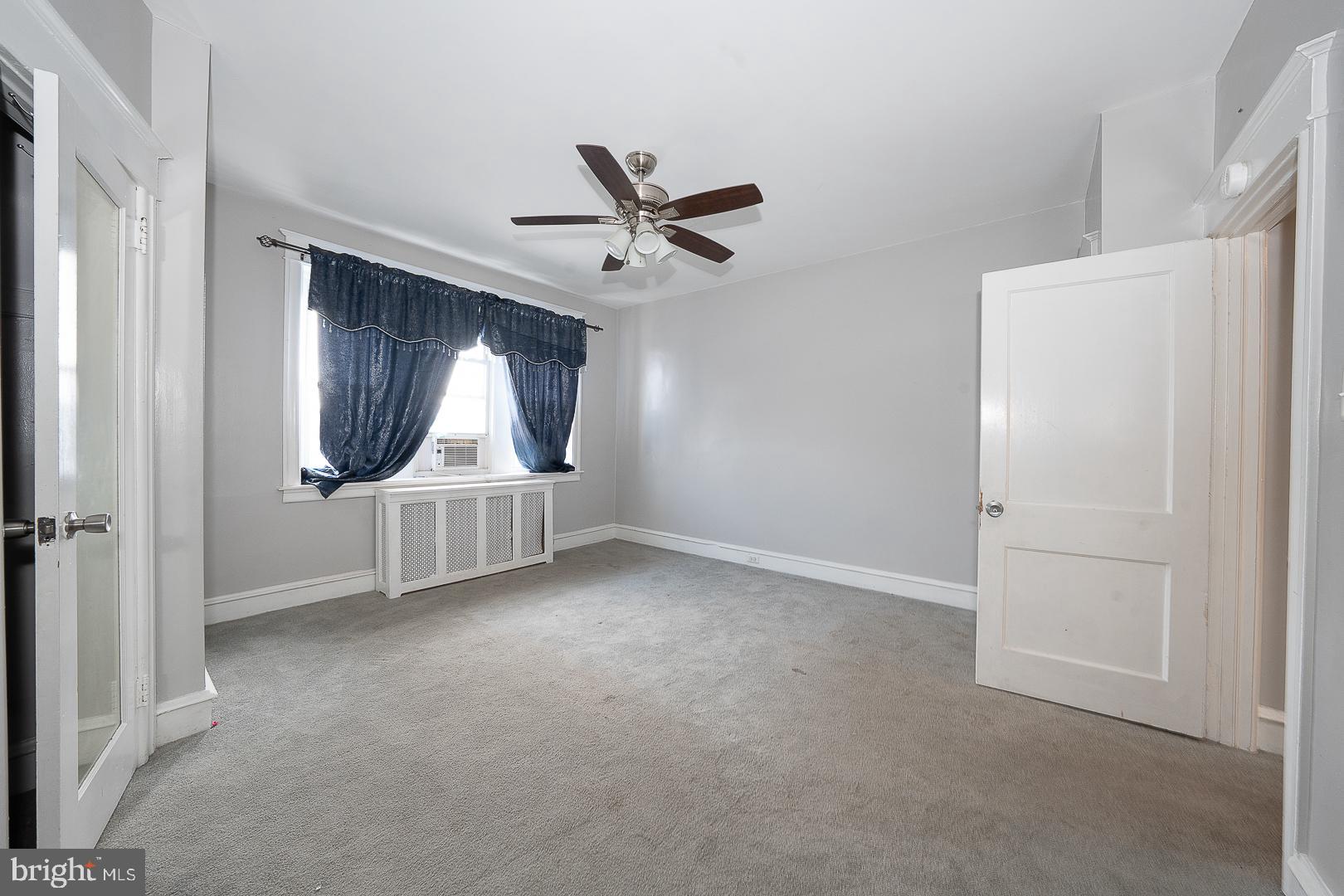 232 Copley Road Upper Darby, PA 19082 - Photo 23 of 47 an empty room with windows and fan