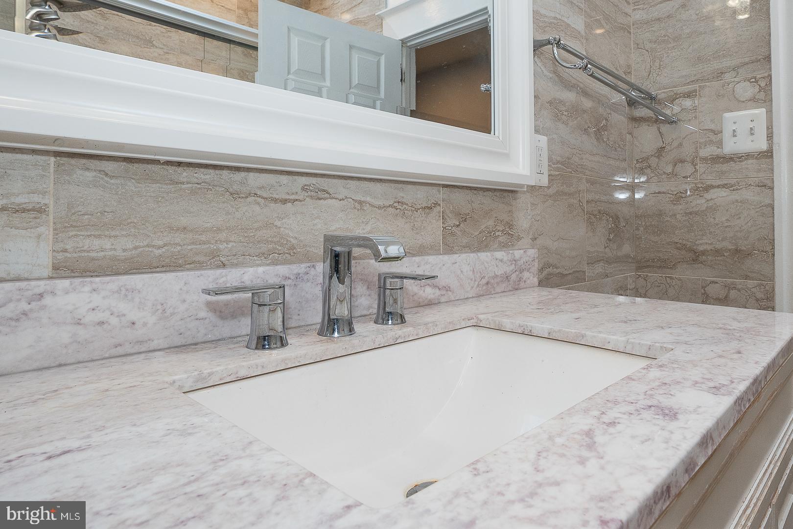 232 Copley Road Upper Darby, PA 19082 - Photo 26 of 47 a bathroom with a granite countertop sink
