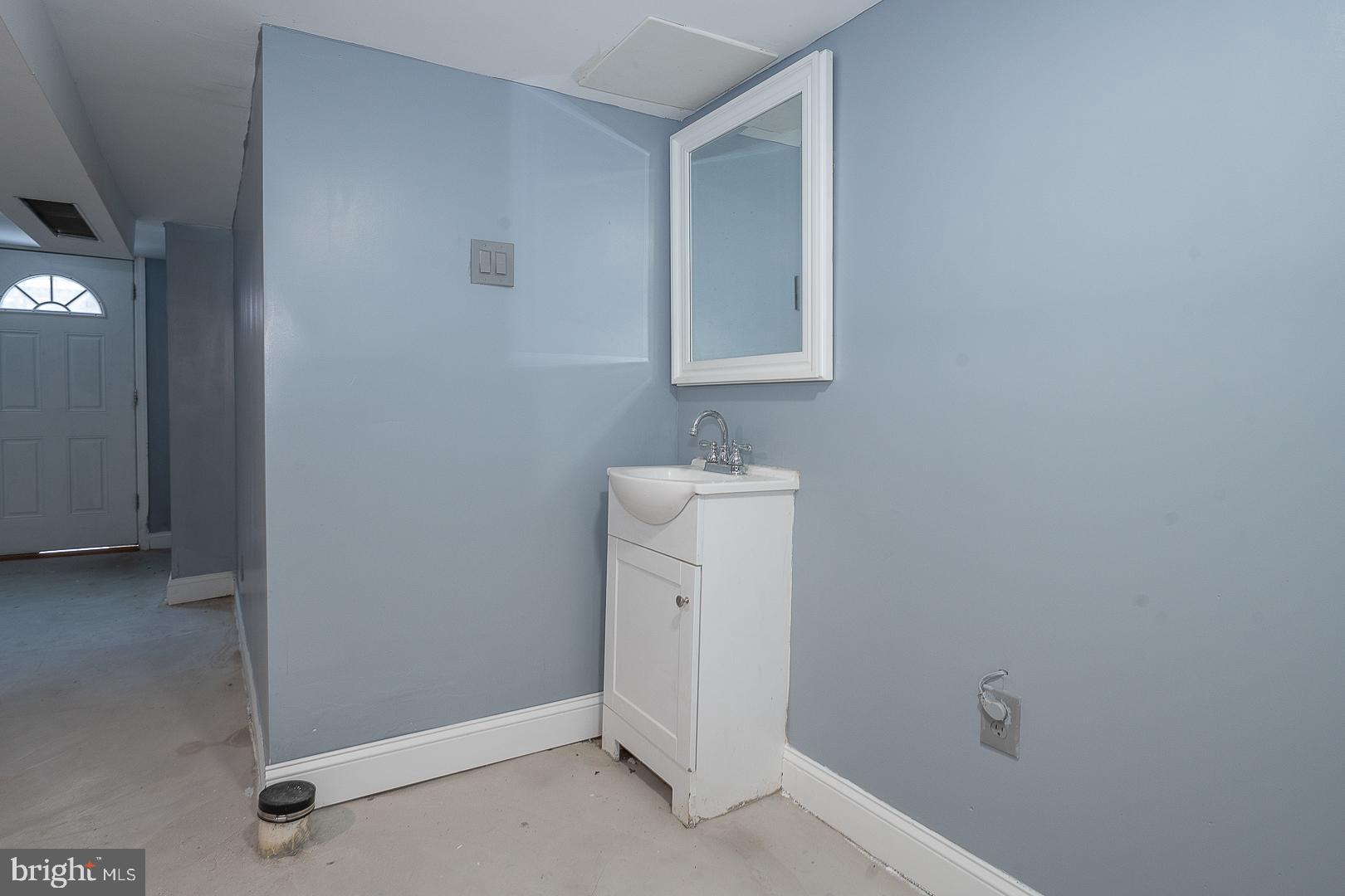 232 Copley Road Upper Darby, PA 19082 - Photo 38 of 47 a bathroom with a sink toilet and vanity