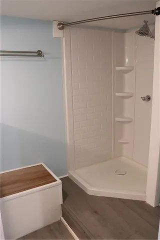 a bathroom with a bathtub and a shower