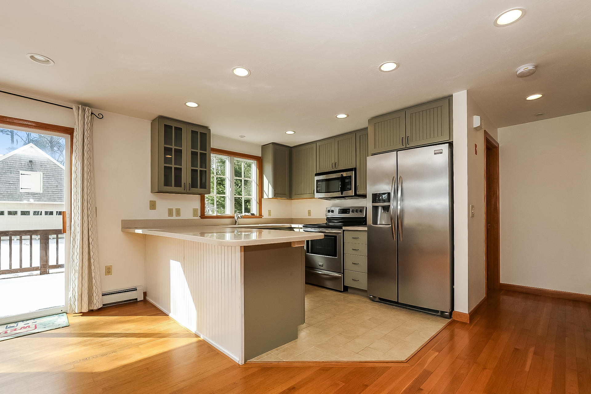 34 Marlboro Road Brewster, MA 02631 - Photo 4 of 23 a kitchen with stainless steel appliances granite countertop a refrigerator a sink a stove and oven