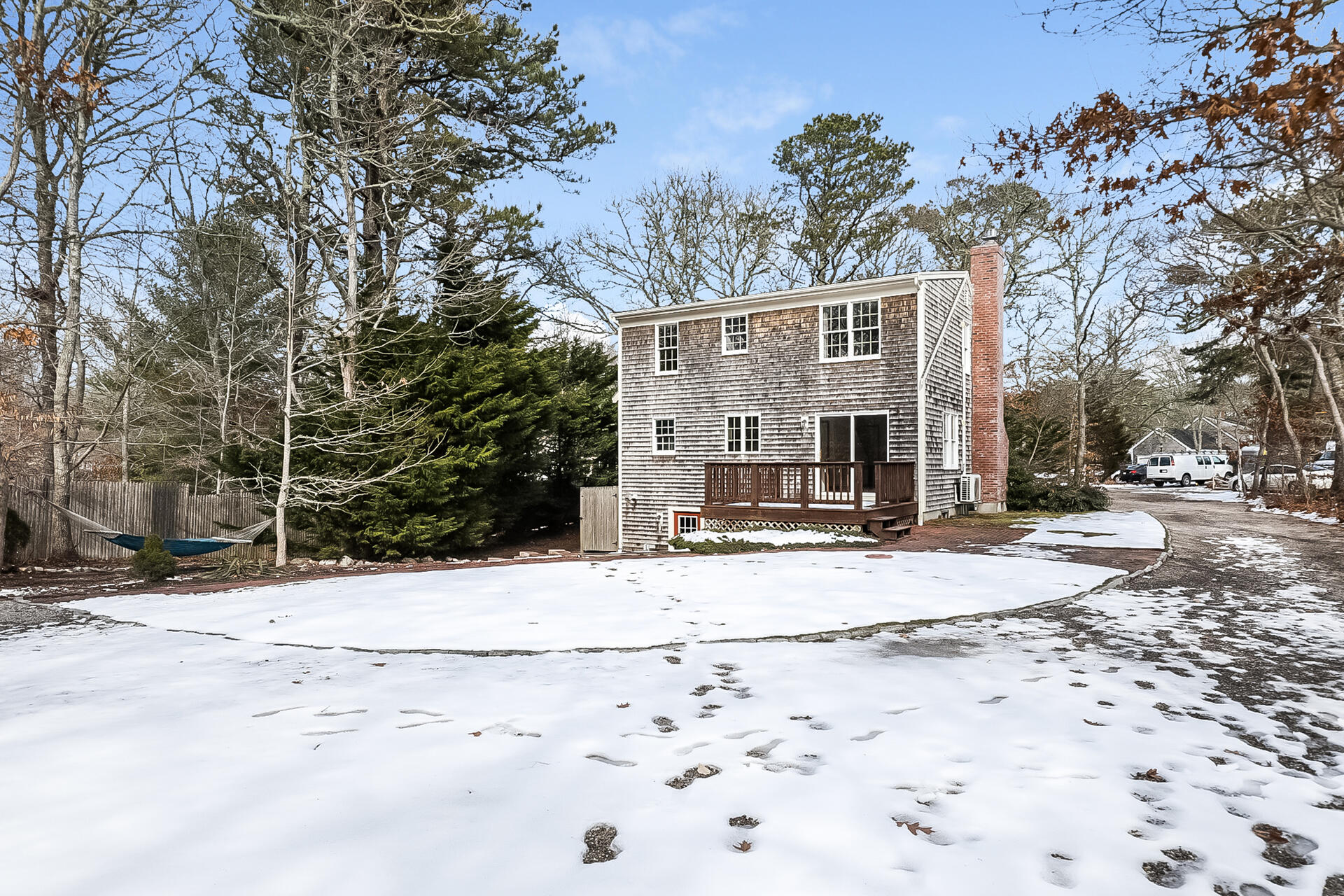 34 Marlboro Road Brewster, MA 02631 - Photo 9 of 23 a view of a house with snow on the road