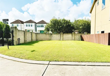 a swimming pool with trees in the background