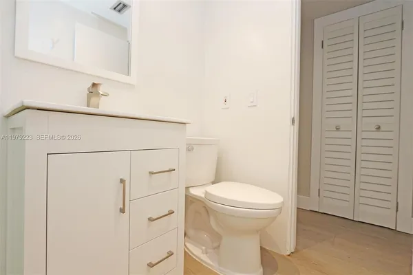 a bathroom with a toilet and a sink