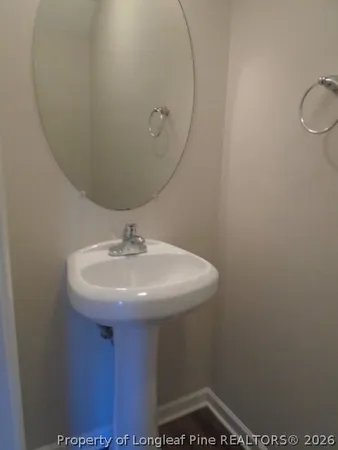 a sink with view of mirror
