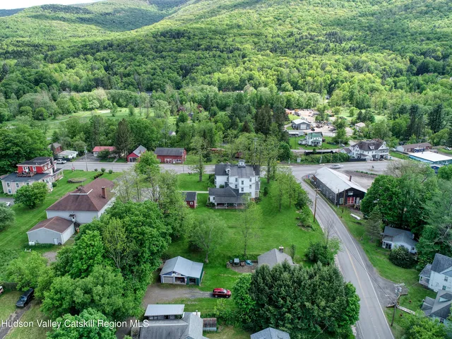 a view of a garden with a building in the background