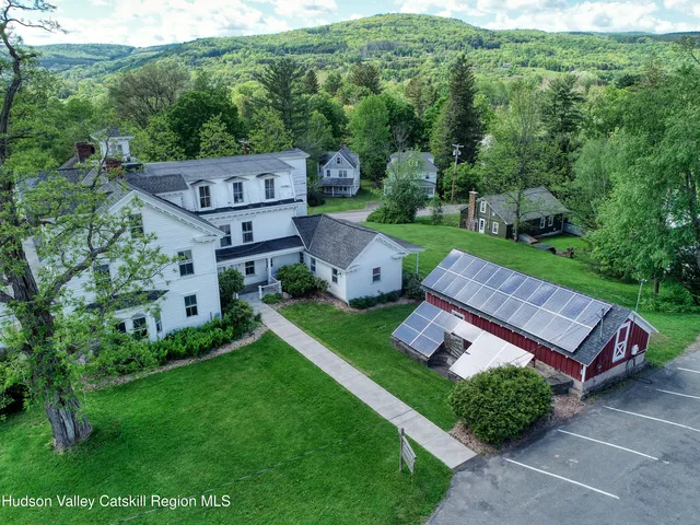 an aerial view of a house with a garden