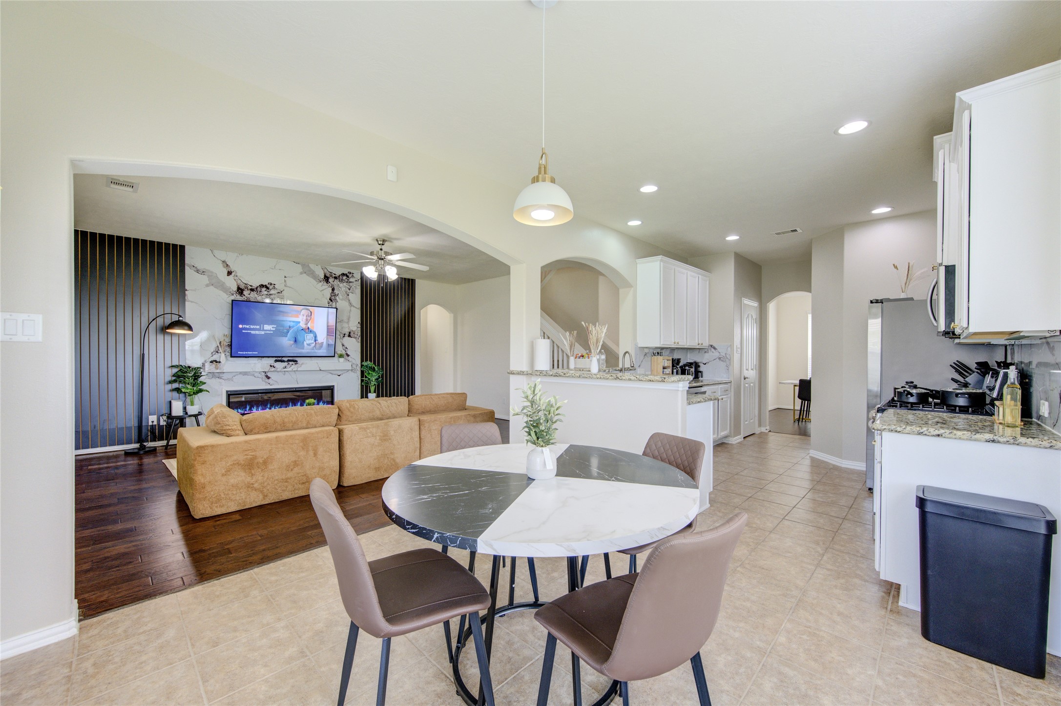 4211 Tristan Ridge Lane Katy, TX 77449 - Photo 11 of 31 a view of a dining room with furniture and wooden floor