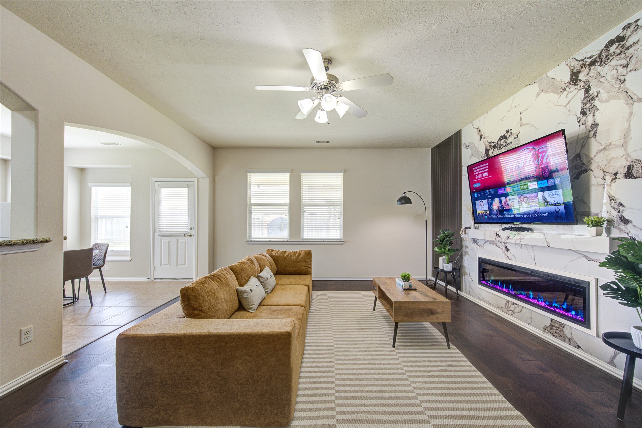 4211 Tristan Ridge Lane Katy, TX 77449 - Photo 14 of 31 a living room with furniture and a flat screen tv