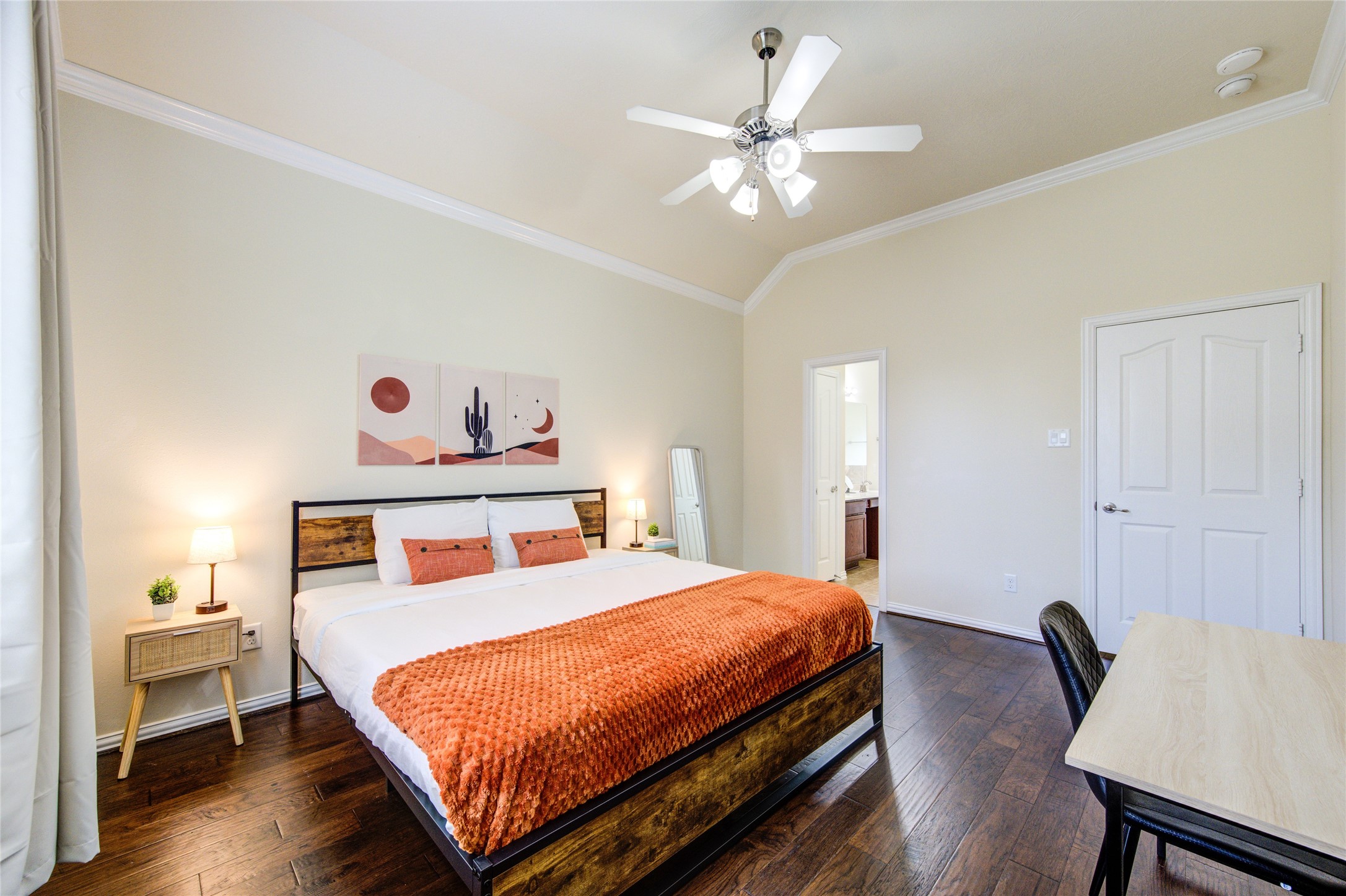 4211 Tristan Ridge Lane Katy, TX 77449 - Photo 17 of 31 a bedroom with a bed and a chandelier