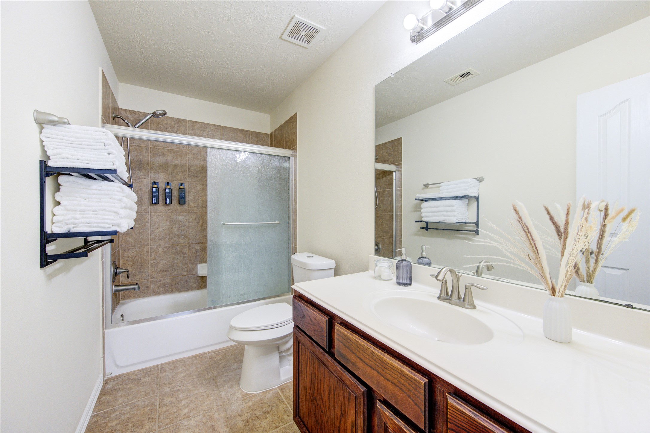 4211 Tristan Ridge Lane Katy, TX 77449 - Photo 24 of 31 a bathroom with a sink a toilet and shower