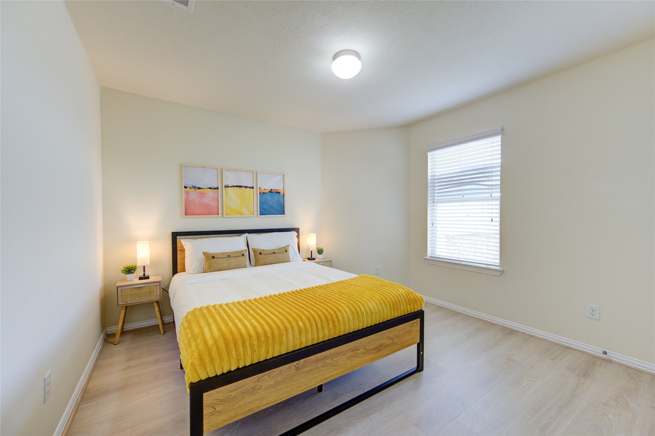 4211 Tristan Ridge Lane Katy, TX 77449 - Photo 27 of 31 a bed sitting in a bedroom next to a window