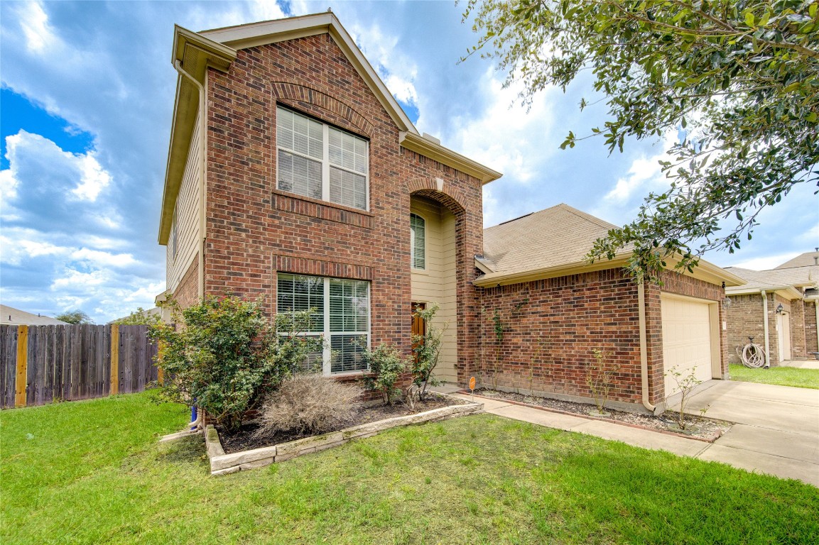 4211 Tristan Ridge Lane Katy, TX 77449 - Photo 3 of 31 a front view of a house with a yard