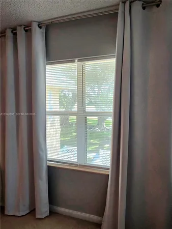 a view of walk in closet with window