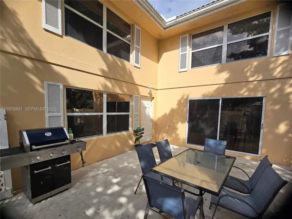 a view of a outdoor space with seating area and furniture