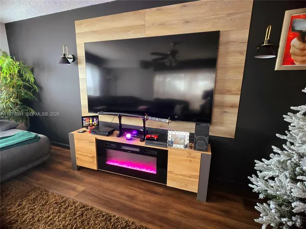 a room with furniture and a flat screen tv
