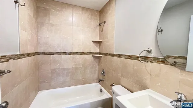 a bathroom with a sink and a bathtub