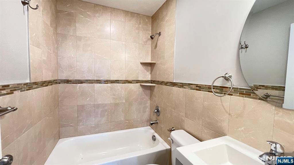 87 Beech Street, Unit 2 Kearny, NJ 07032 - Photo 13 of 13 a bathroom with a sink and a bathtub