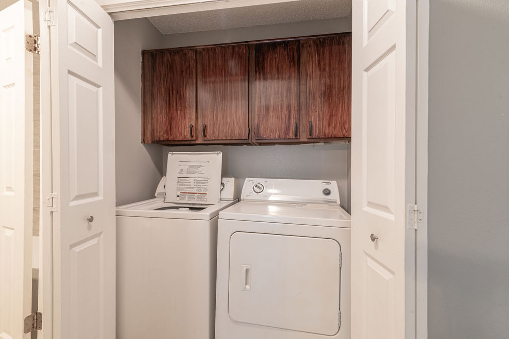 1810 Nicole Circle, Unit B Round Rock, TX 78664 - Photo 17 of 30 a view of storage and utility room with washer and dryer