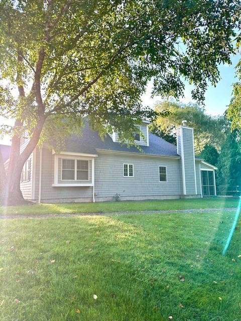52 County Road, Unit 8 Mattapoisett, MA 02739 - Photo 3 of 19 a backyard of a house with lots of green space