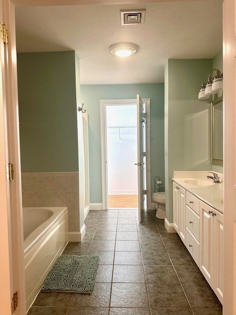 52 County Road, Unit 8 Mattapoisett, MA 02739 - Photo 8 of 19 a bathroom with a mirror and a bathtub