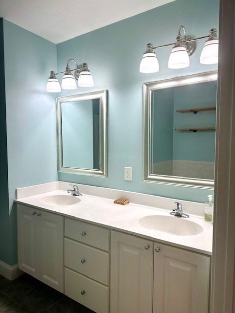 52 County Road, Unit 8 Mattapoisett, MA 02739 - Photo 10 of 19 a bathroom with double vanity sink and a mirror