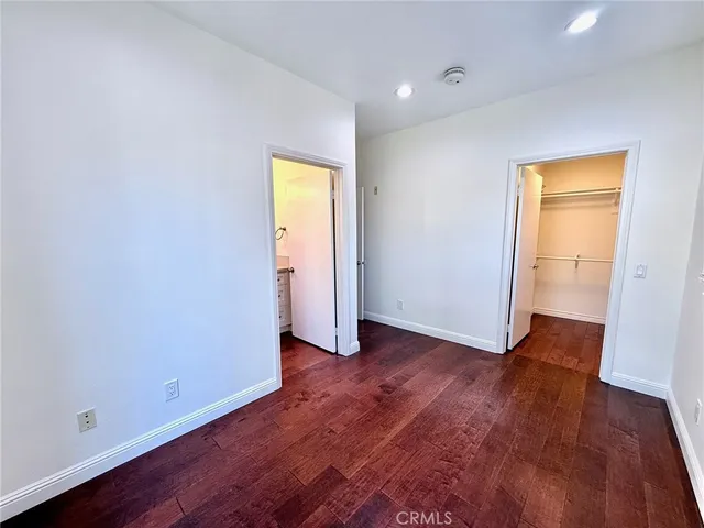 a bathroom with a granite countertop sink a toilet and a bathtub