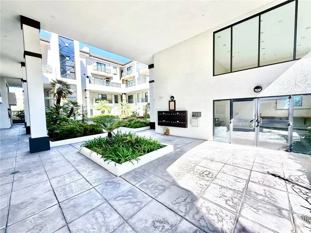 a bedroom with a bed and a table