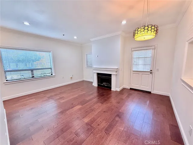 a kitchen with a refrigerator and a stove top oven