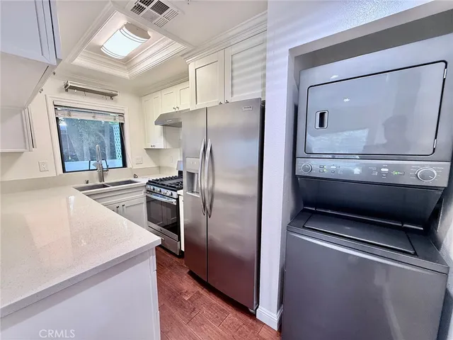 a kitchen with a stove and a refrigerator