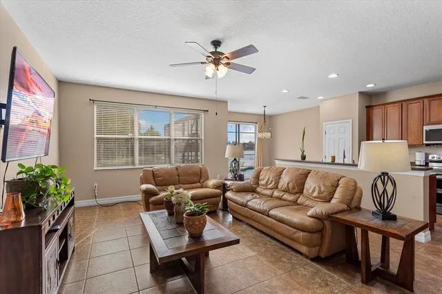 a living room with furniture and a large window