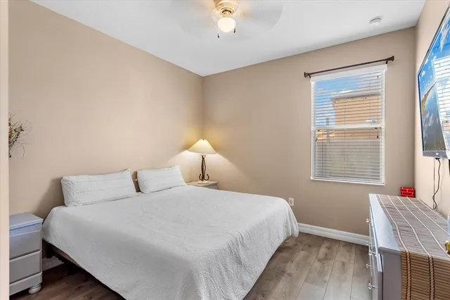 a bedroom with bed and a window