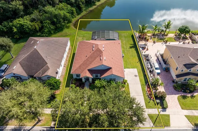 an aerial view of house with yard swimming pool and outdoor seating