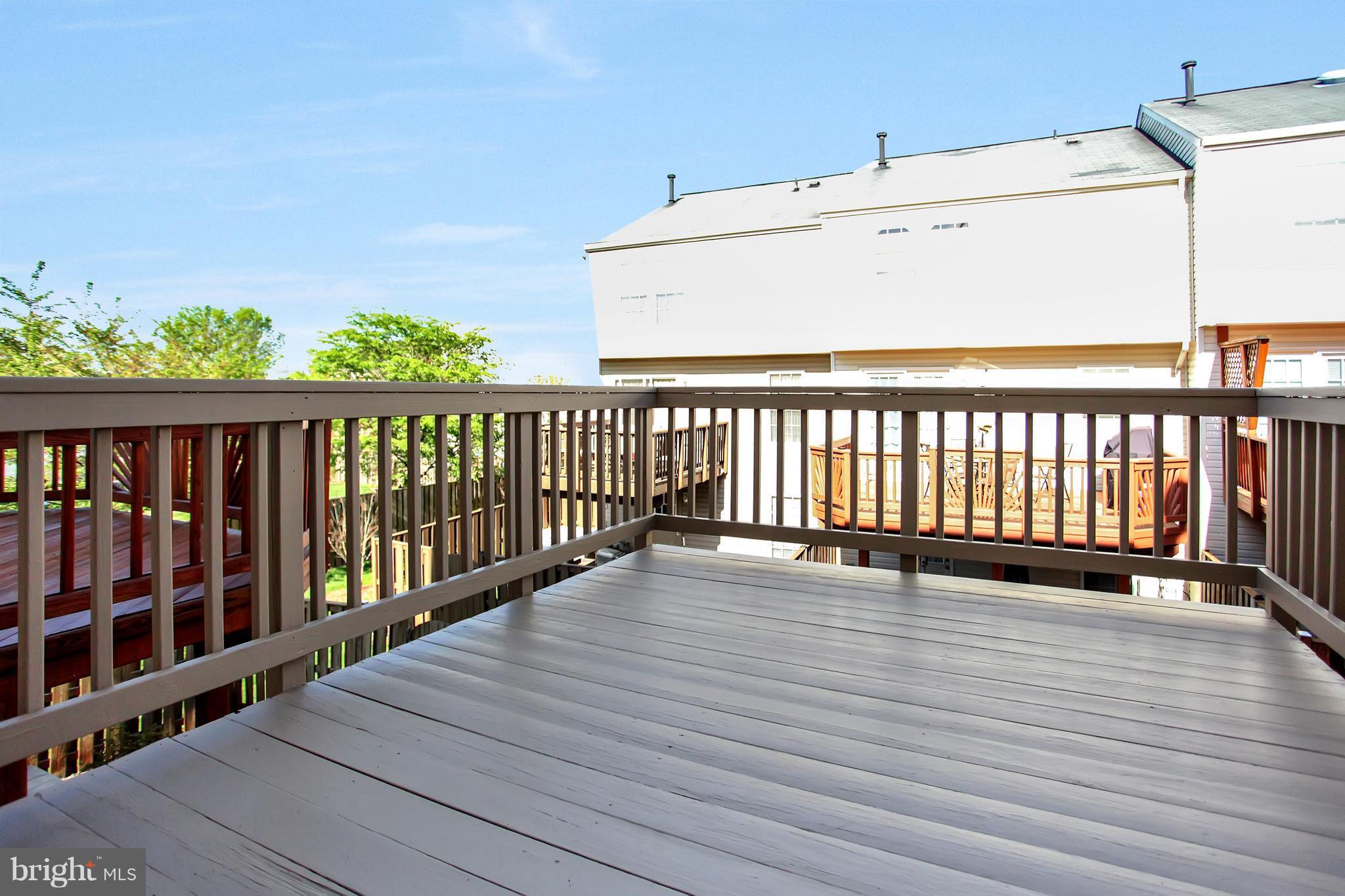 6496 Topsails Lane Springfield, VA 22150 - Photo 14 of 21 Freshly Stained Deck Off Kitchen