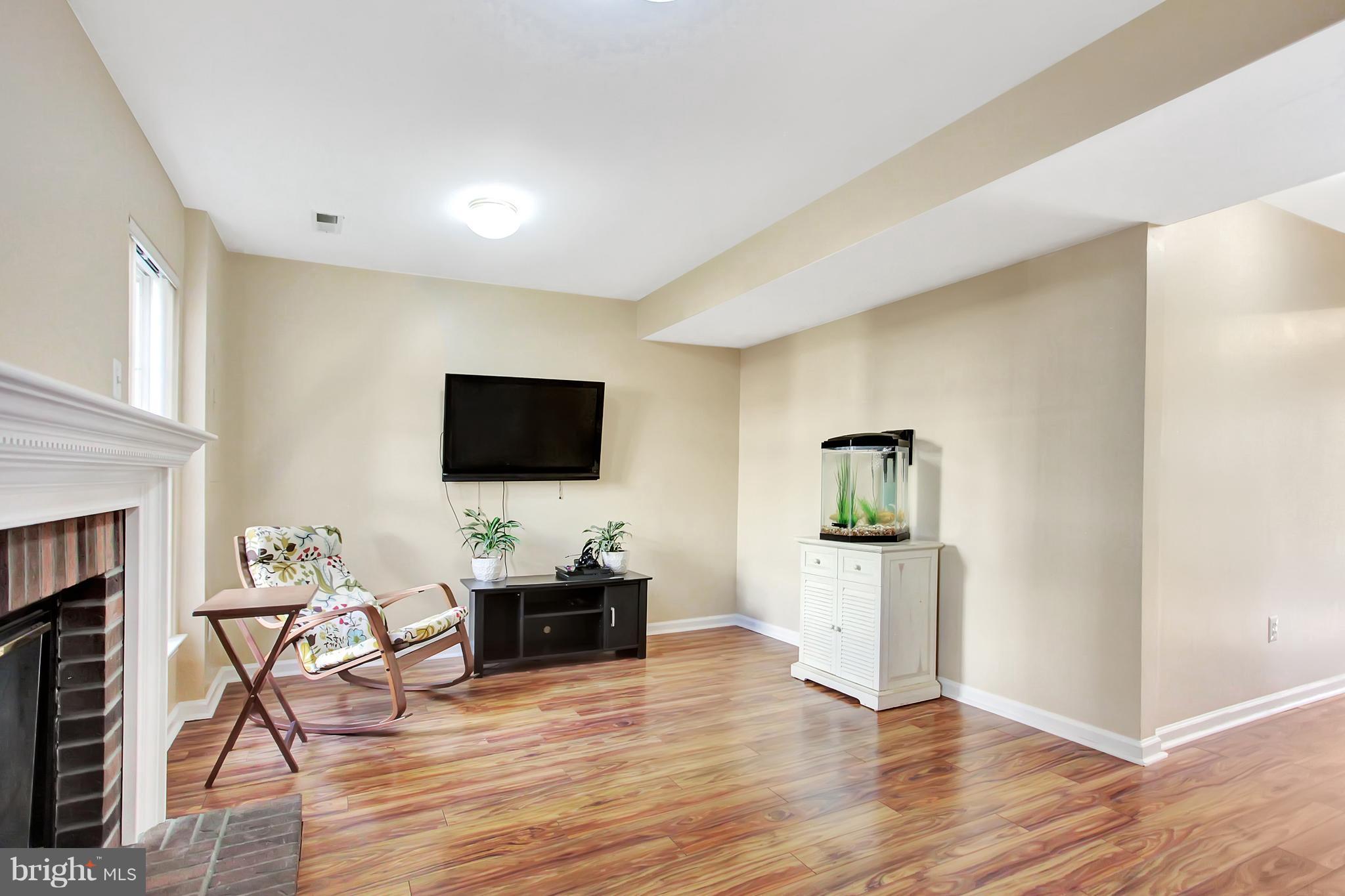 6496 Topsails Lane Springfield, VA 22150 - Photo 6 of 21 Basement Recreation Room With Gas Fireplace