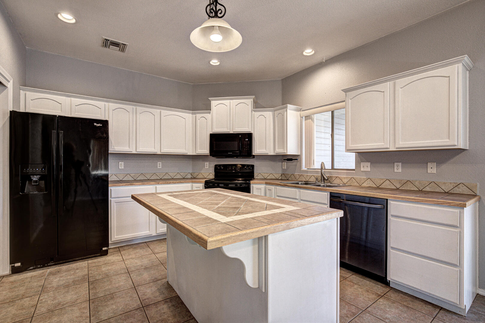 334 East Cedar Mill Road Star Valley, AZ 85541 - Photo 7 of 32 a kitchen with a stove a sink and a refrigerator