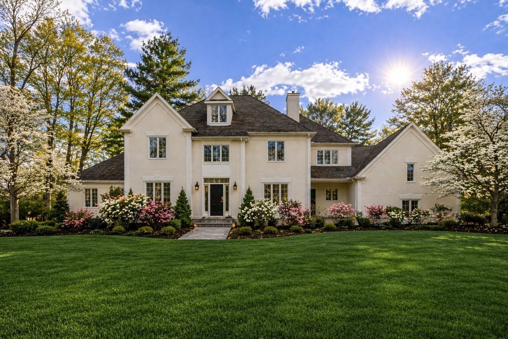 58 Buttrick Lane Carlisle, MA 01741 - Photo 1 of 39 a front view of house with yard and green space