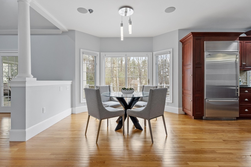 58 Buttrick Lane Carlisle, MA 01741 - Photo 12 of 39 a view of a dining room with furniture window and wooden floor