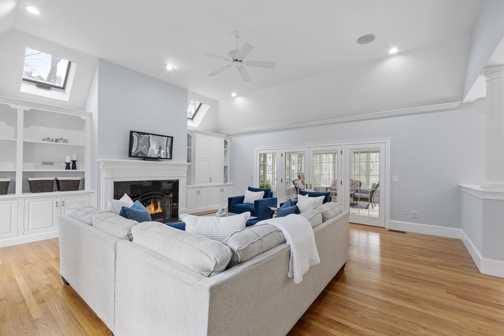58 Buttrick Lane Carlisle, MA 01741 - Photo 16 of 39 a living room with furniture and a fireplace