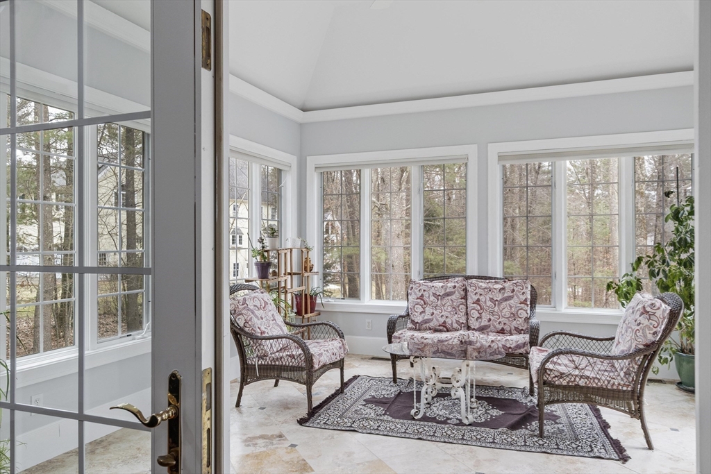 58 Buttrick Lane Carlisle, MA 01741 - Photo 17 of 39 a living room with furniture and a floor to ceiling window