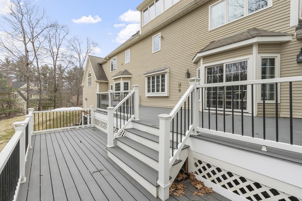 58 Buttrick Lane Carlisle, MA 01741 - Photo 19 of 39 a view of a house with wooden deck