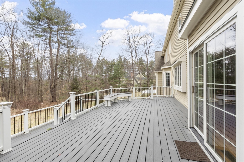 58 Buttrick Lane Carlisle, MA 01741 - Photo 21 of 39 a view of a balcony with wooden floor and fence