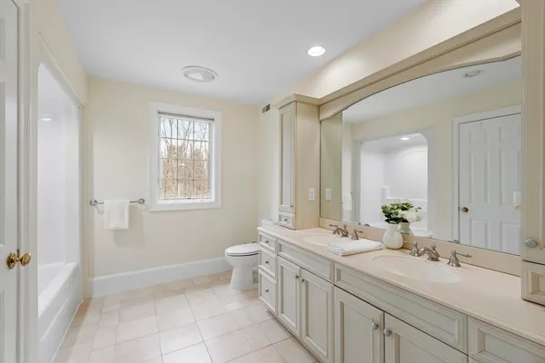 a utility room with cabinets washer and dryer