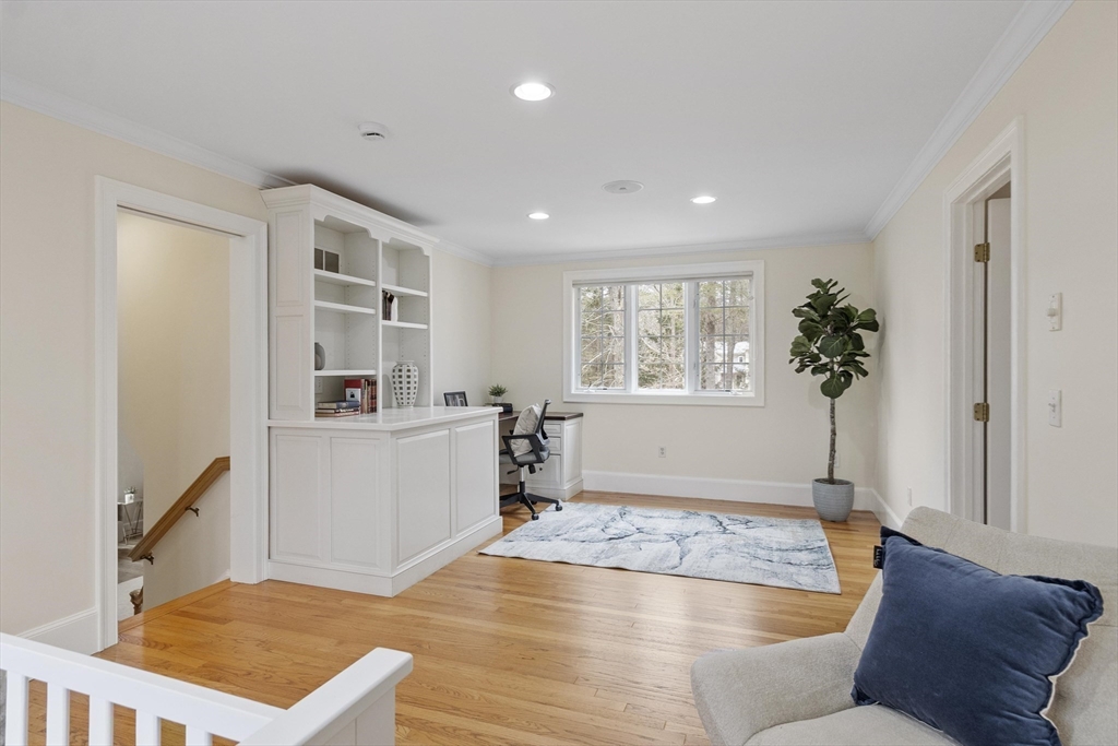 58 Buttrick Lane Carlisle, MA 01741 - Photo 32 of 39 a living room with furniture and a window