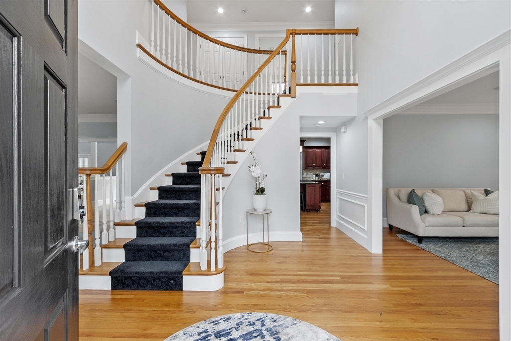 58 Buttrick Lane Carlisle, MA 01741 - Photo 4 of 39 a view of entryway and hall with wooden floor