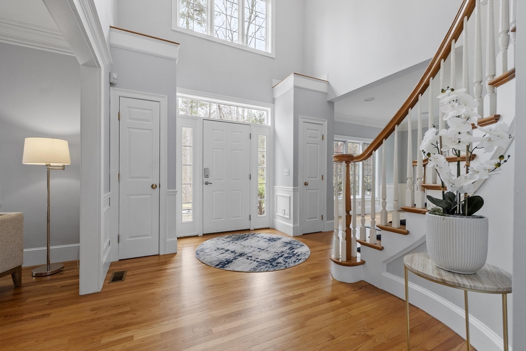58 Buttrick Lane Carlisle, MA 01741 - Photo 5 of 39 a view of a livingroom with furniture and stairs