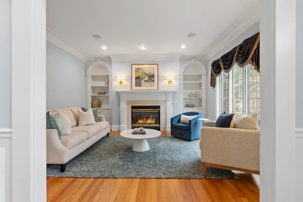 a view of a a dining room with furniture wooden floor and chandelier