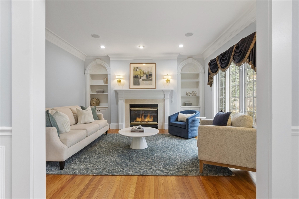 58 Buttrick Lane Carlisle, MA 01741 - Photo 6 of 39 a living room with furniture and a fireplace