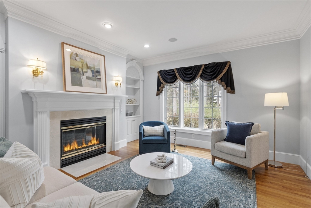 58 Buttrick Lane Carlisle, MA 01741 - Photo 7 of 39 a living room with furniture and a fireplace